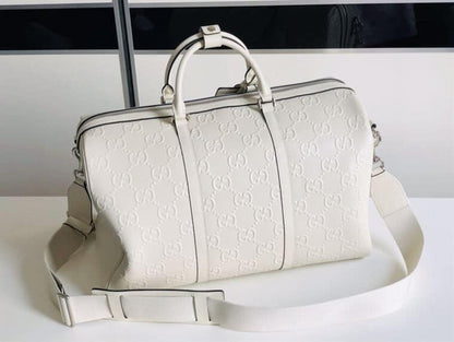 Gucci GG Embossed Duffle Bag - White