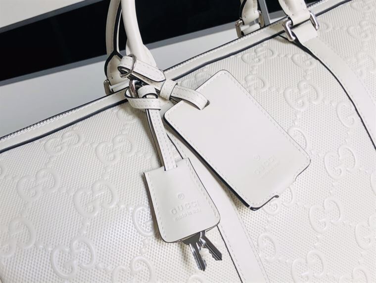 Gucci GG Embossed Duffle Bag - White