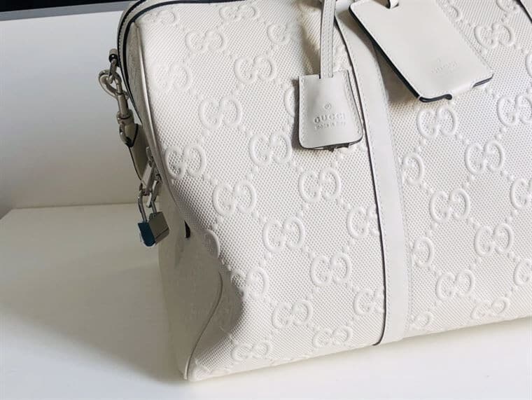 Gucci GG Embossed Duffle Bag - White