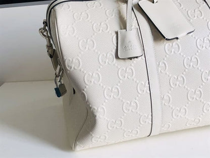 Gucci GG Embossed Duffle Bag - White
