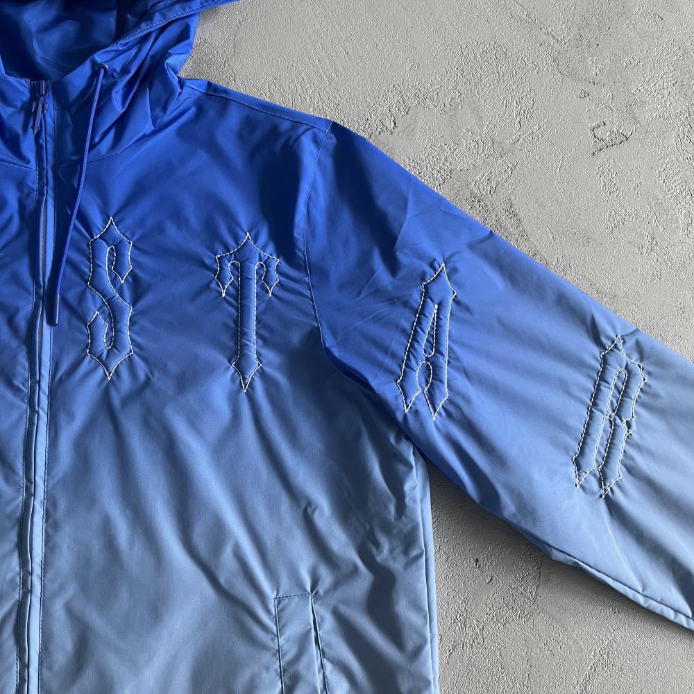 TS Outline Arch Windbreaker - Sky Blue
